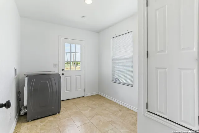 a big house with a big yard and large trees