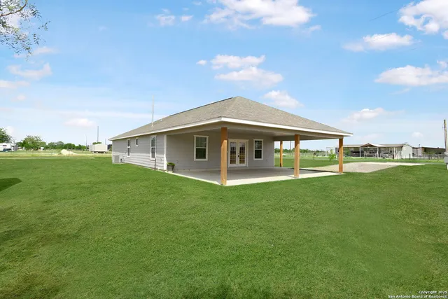 a view of empty room with wooden ceiling