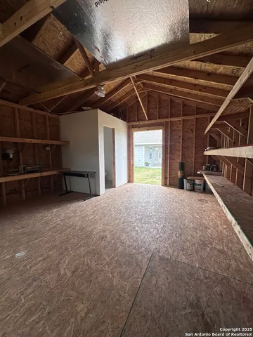 a view of a house with backyard and garden