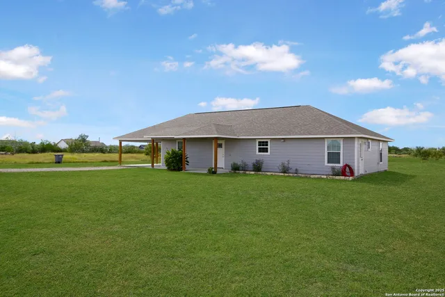 a view of a house with a big yard