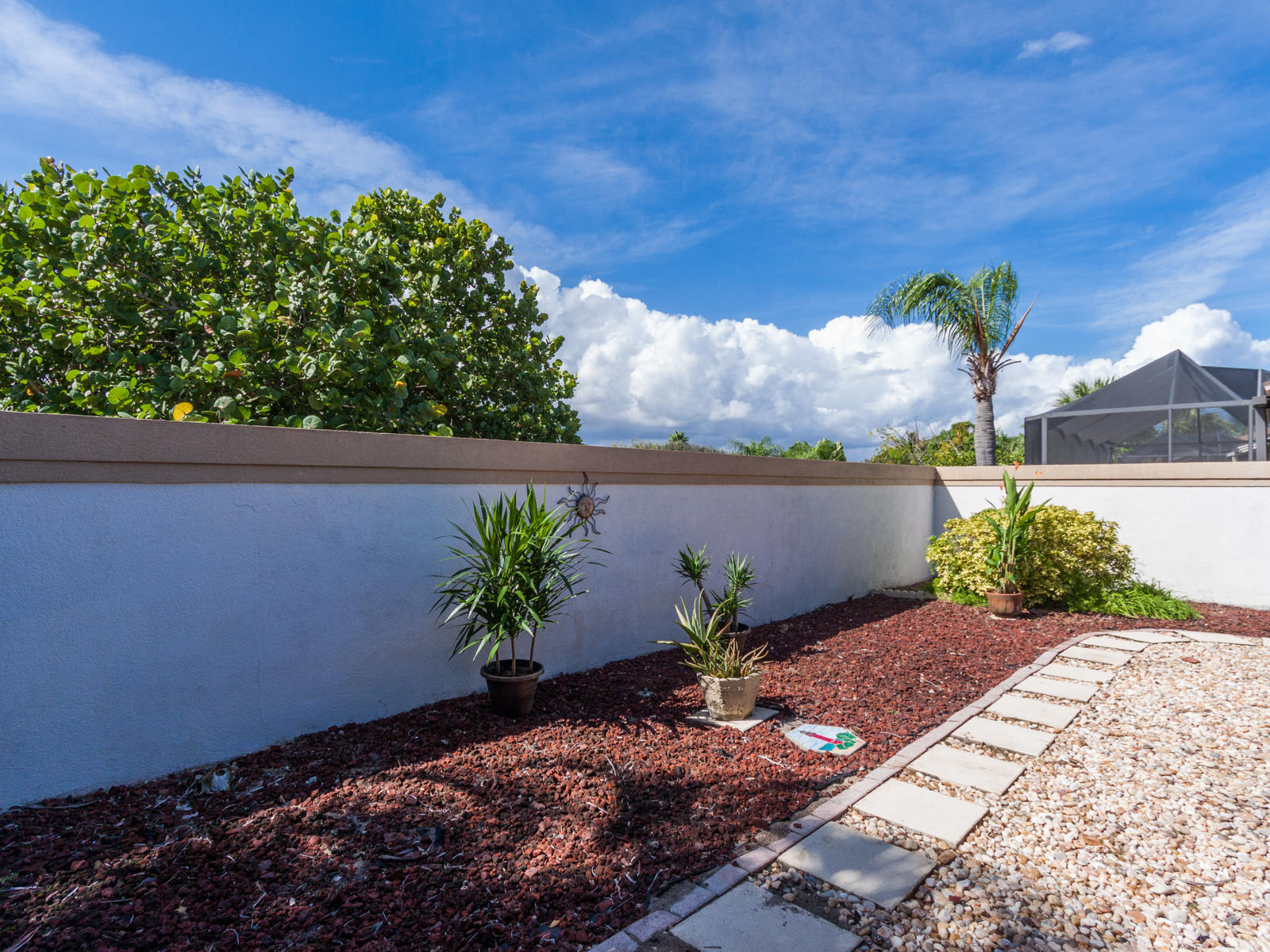 186 Ridge Road Jupiter, FL 33477 - Photo 40 of 44 a front view of a house with a yard