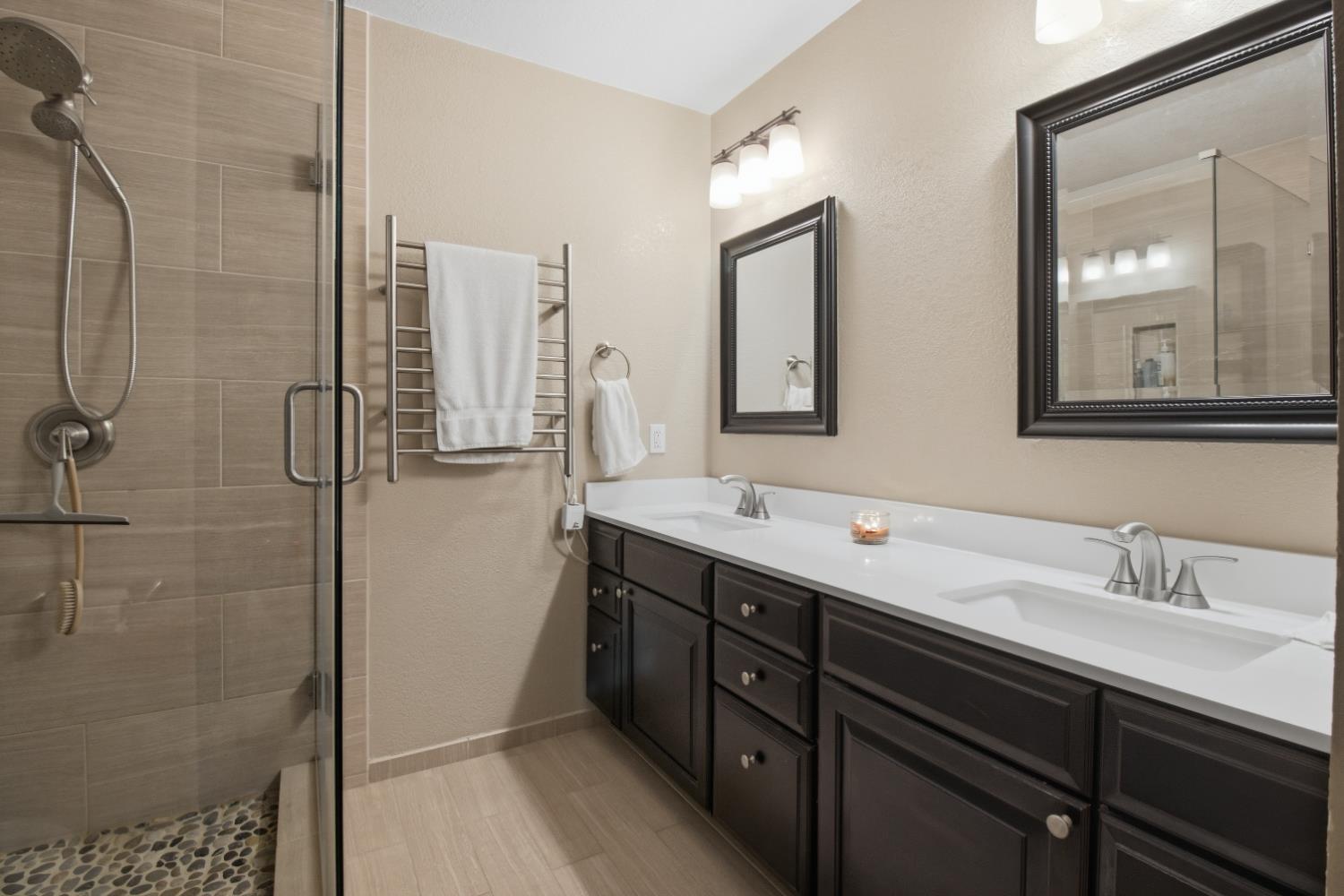 4599 Rivendale Road Placerville, CA 95667 - Photo 12 of 27 a bathroom with a double vanity sink mirror and shower