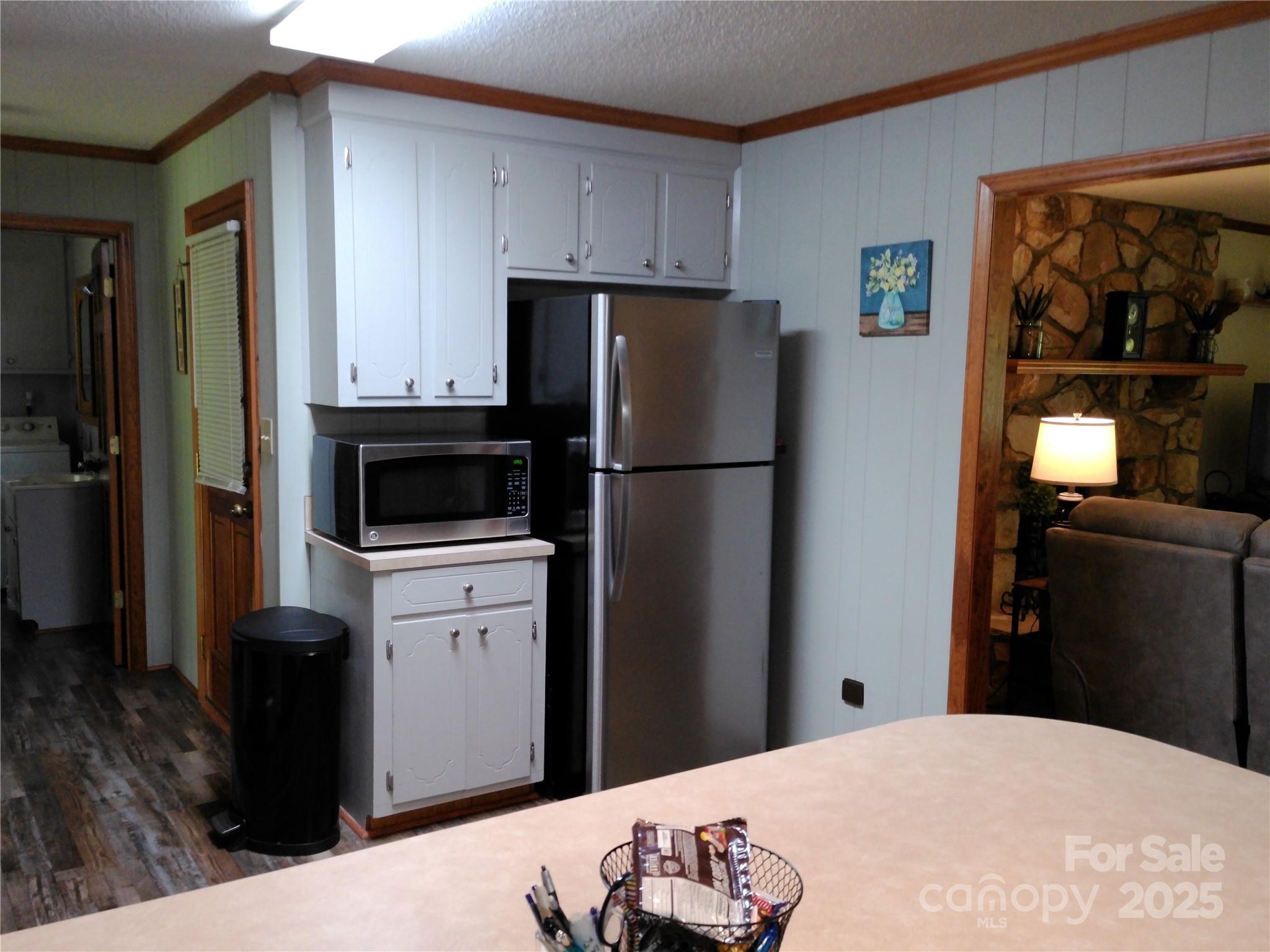 216 Williams Road Harrisburg, NC 28075 - Photo 12 of 28 a kitchen with a refrigerator and a stove