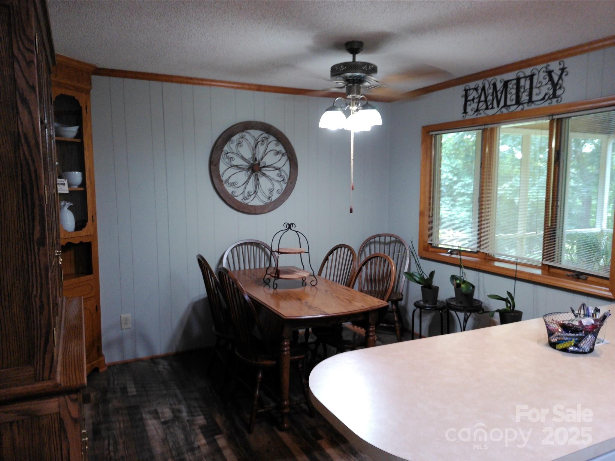 216 Williams Road Harrisburg, NC 28075 - Photo 13 of 28 a view of a dining room with furniture and a chandelier