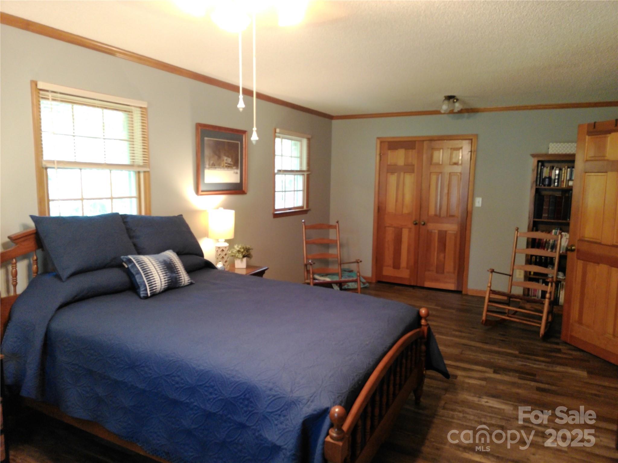 216 Williams Road Harrisburg, NC 28075 - Photo 16 of 28 a bedroom with a bed and wooden floor