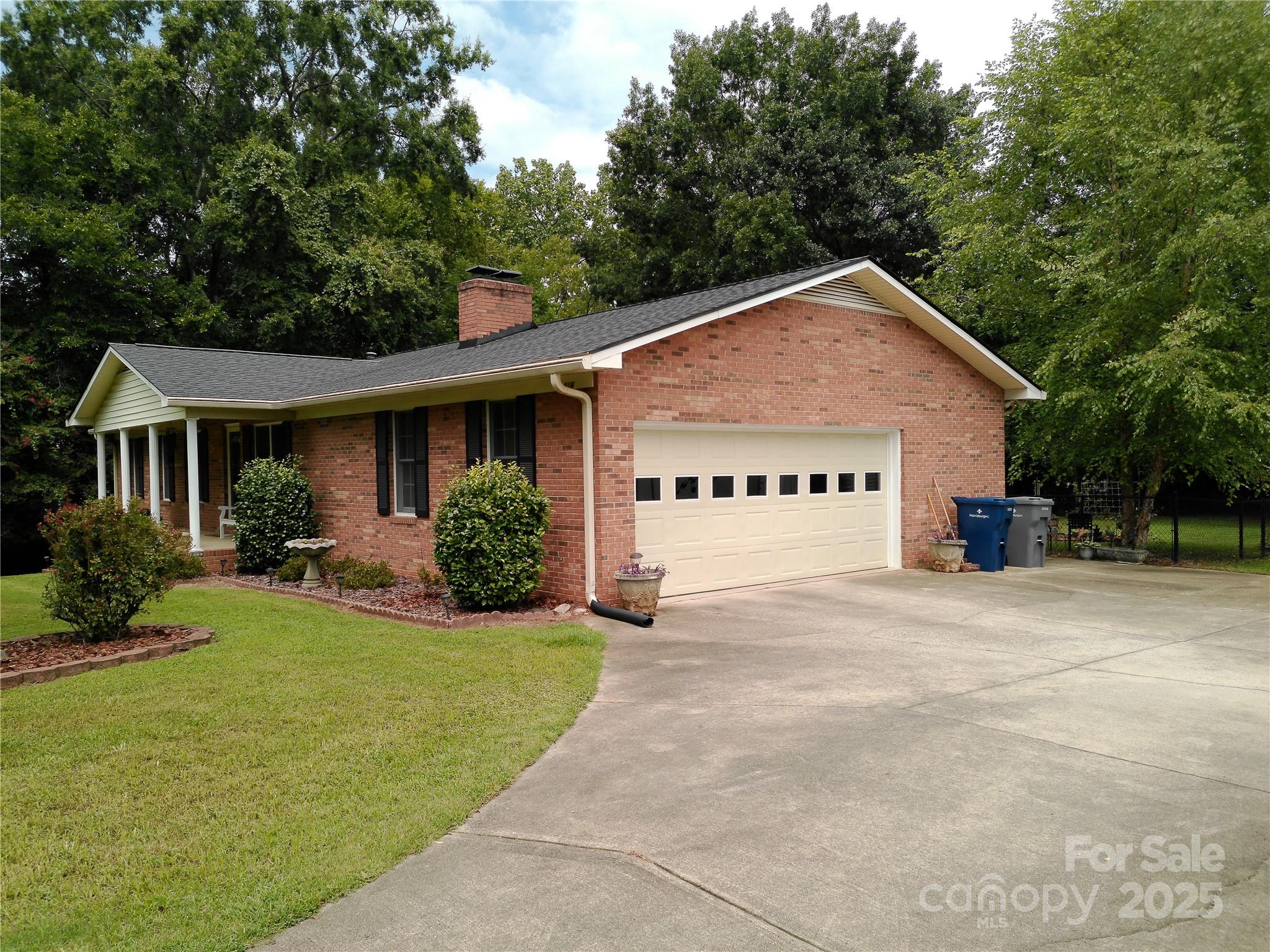 216 Williams Road Harrisburg, NC 28075 - Photo 2 of 28 a view of a house with backyard and garden