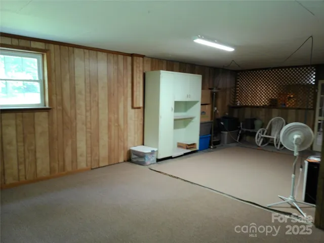 a view of a room with furniture and windows