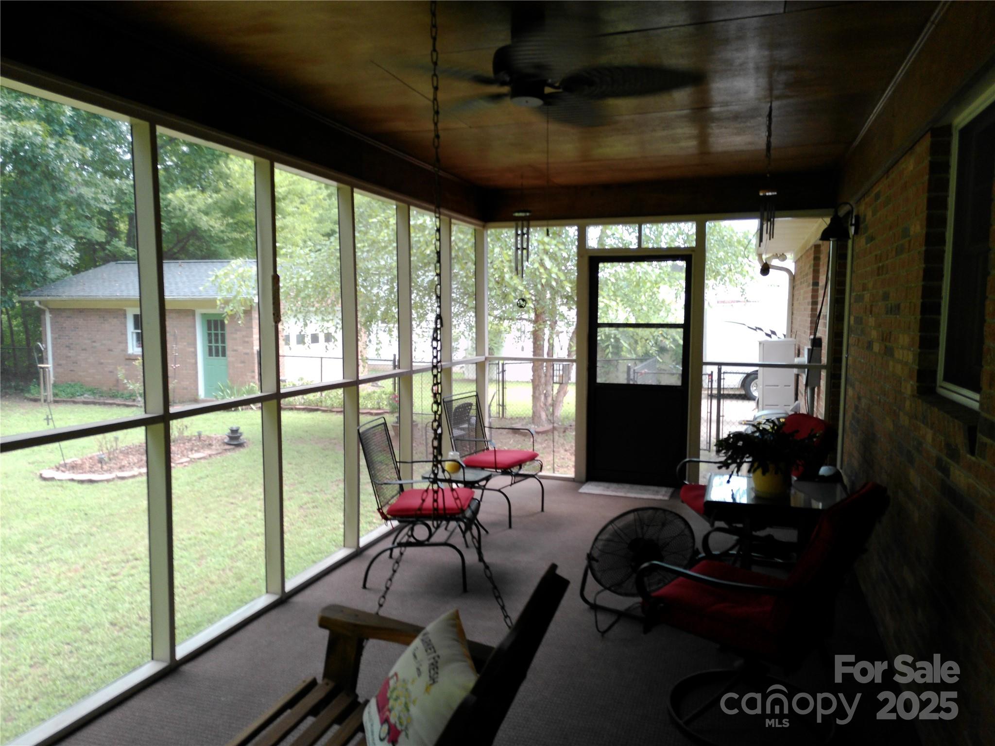 216 Williams Road Harrisburg, NC 28075 - Photo 8 of 28 a room with furniture and a flat screen tv