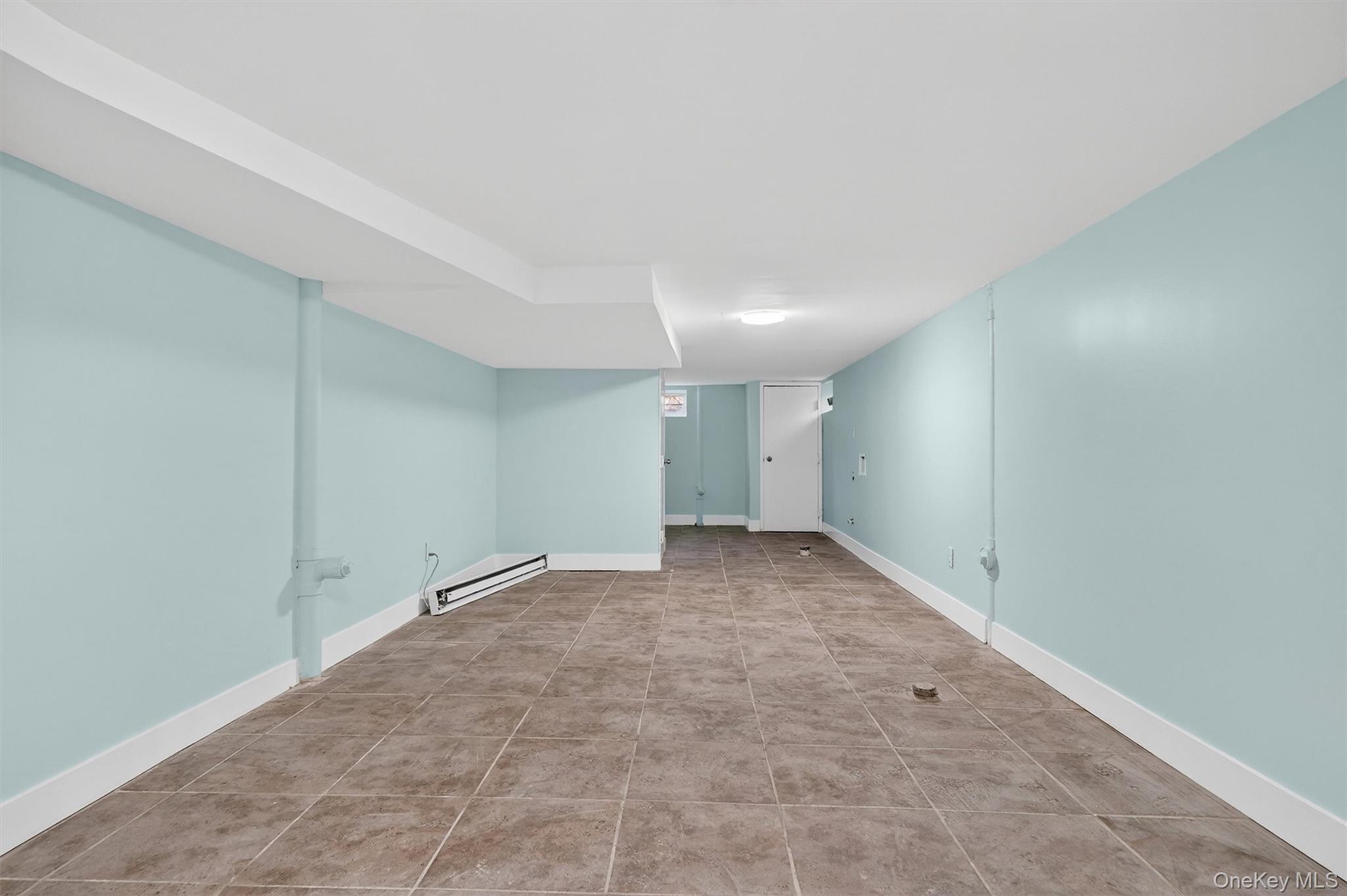 636 Throgs Neck Expressway Bronx, NY 10465 - Photo 30 of 31 Finished basement with baseboard heating and baseboards