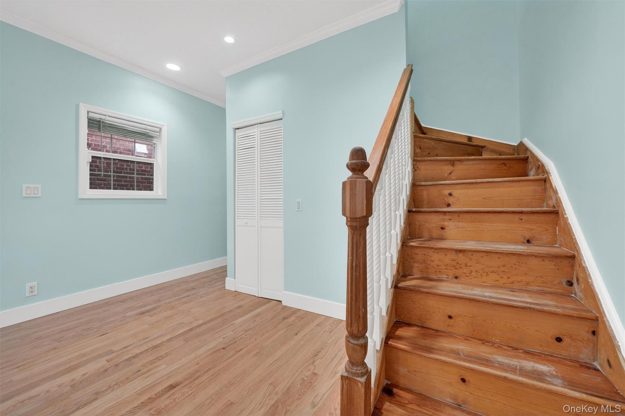 636 Throgs Neck Expressway Bronx, NY 10465 - Photo 9 of 31 Stairway with wood finished floors, recessed lighting, and crown molding