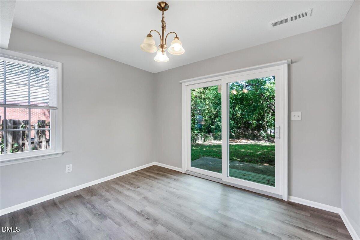 3408 Atlantic Avenue Raleigh, NC 27604 - Photo 32 of 48 a view of empty room with wooden floor and fan