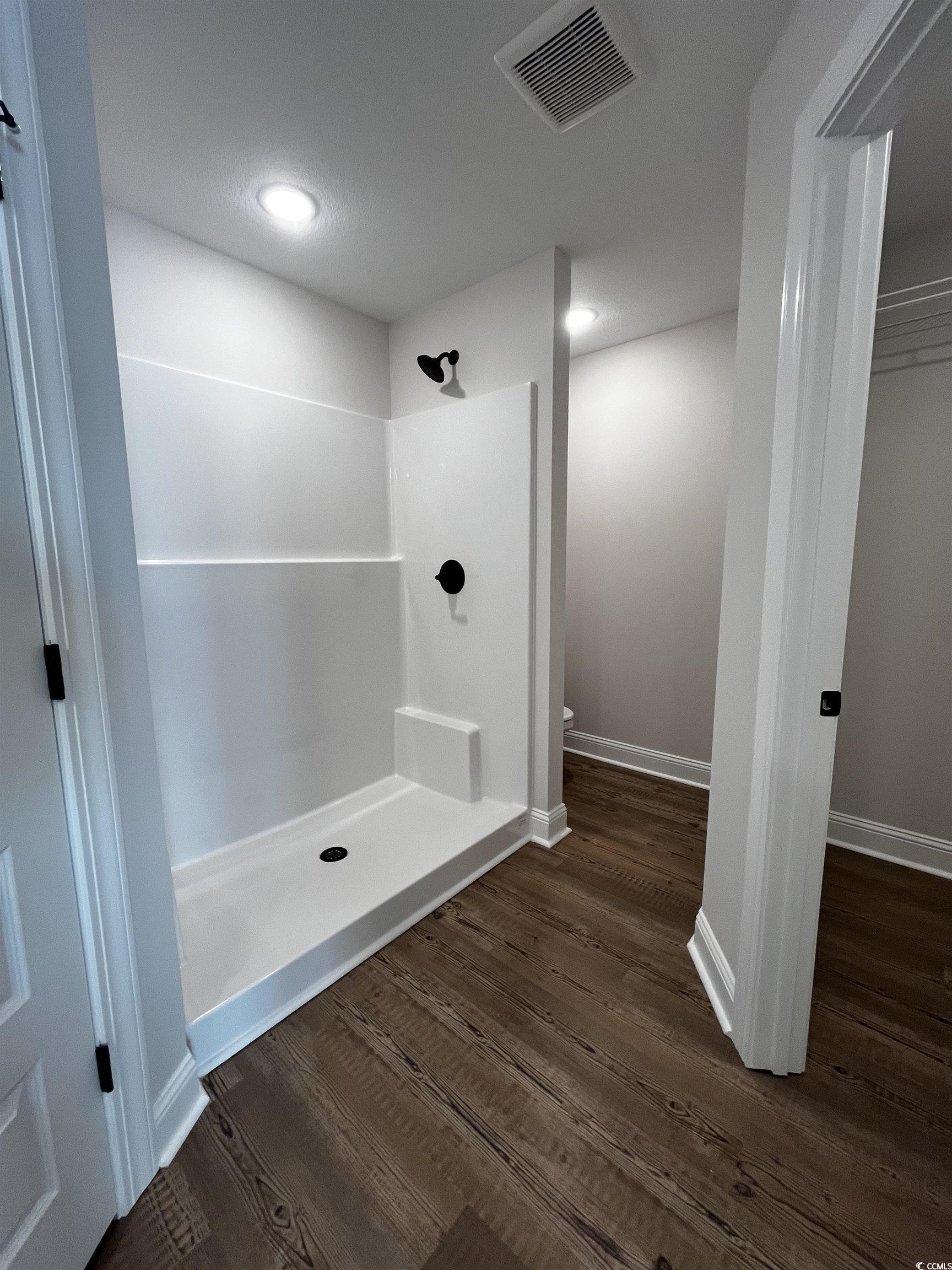 3428 Asbury Road Aynor, SC 29511 - Photo 7 of 10 Bathroom with a shower stall, dark wood-style floors, and recessed lighting