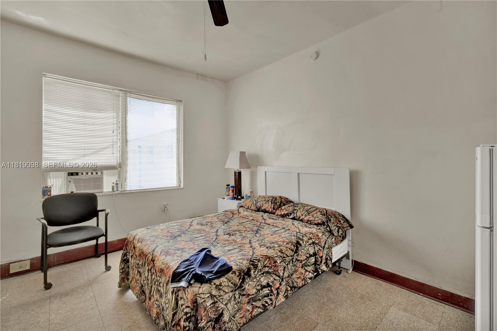 829 Southwest 19th Avenue Miami, FL 33135 - Photo 40 of 54 a bedroom with a bed and window