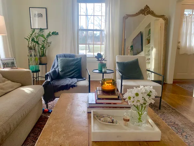 a living room with furniture and a fireplace