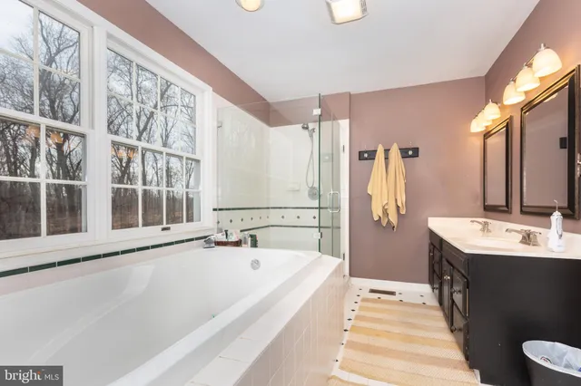 a view of a kitchen with sink and cabinets