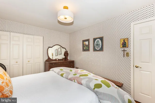 a view of a house with a yard covered in snow