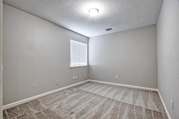 a bathroom with a sink toilet vanity and shower