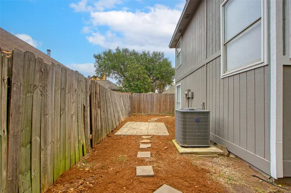 a view of a house with a small yard