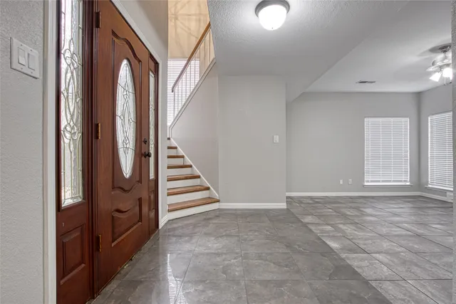 a view of an entryway with staircase