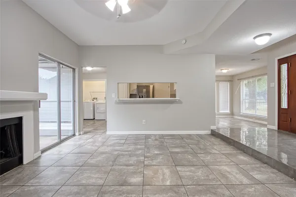 a view of a kitchen with a sink and a fireplace