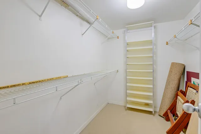 a view of walk in closet with stairs