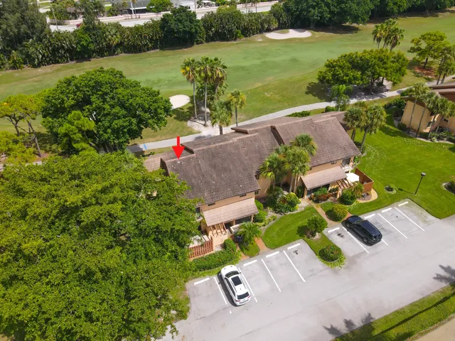 an aerial view of a house with yard swimming pool and outdoor seating