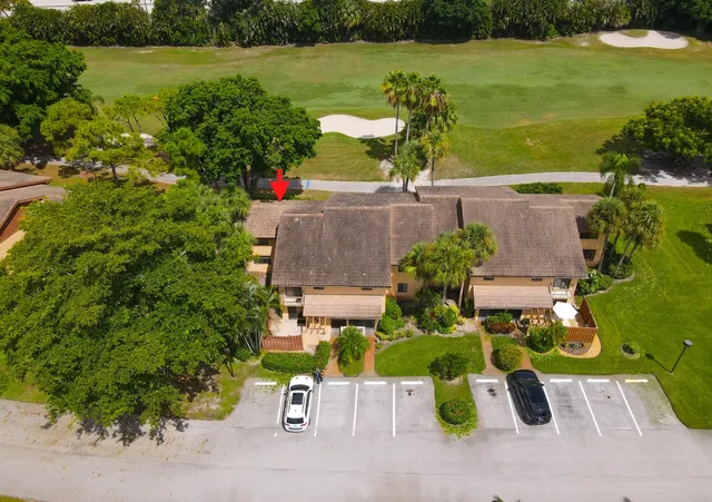 an aerial view of a house with garden space and outdoor seating