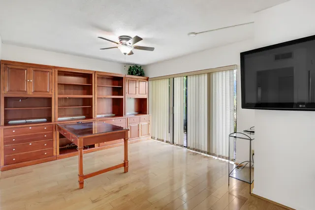 a view of a livingroom with furniture and staircase