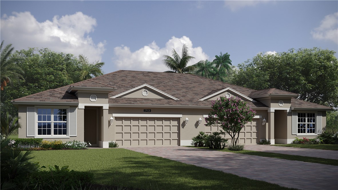 6145 Bella Rosa Lane Vero Beach, FL 32966 - Photo 1 of 8 a front view of a house with a yard