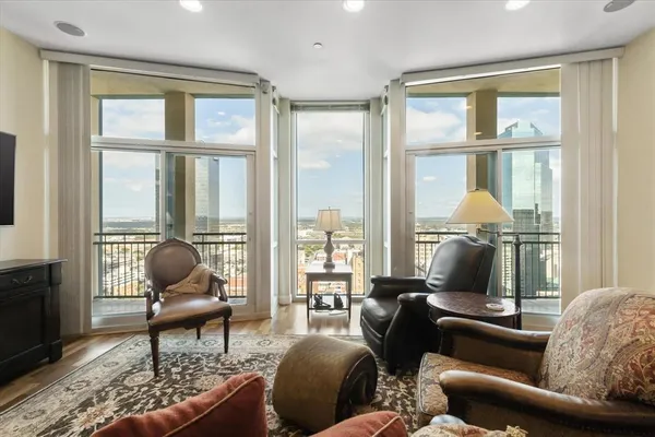 a living room with furniture and a large window
