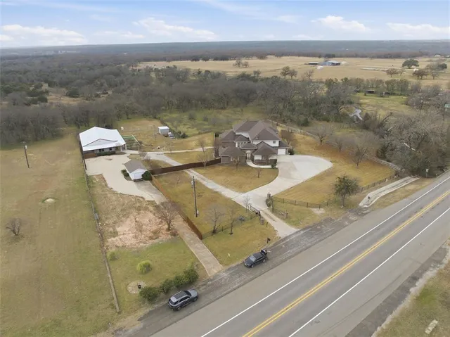 an aerial view of a house with beach