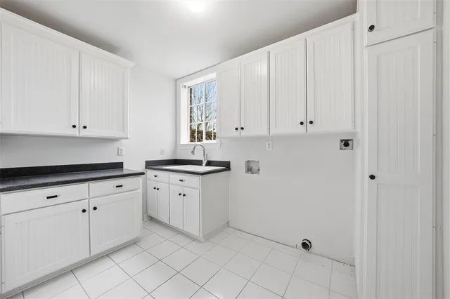 a kitchen with white cabinets