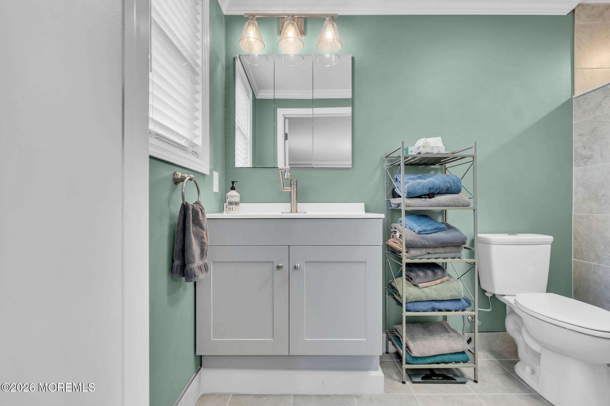 181 Locust Avenue Howell, NJ 07731 - Photo 42 of 66 a bathroom with a sink toilet vanity and mirror