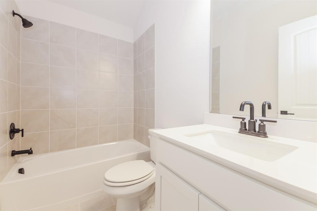 2610 Hawkins Street Anna, TX 75409 - Photo 14 of 17 Full bathroom with bathing tub / shower combination, vanity, and tile patterned floors