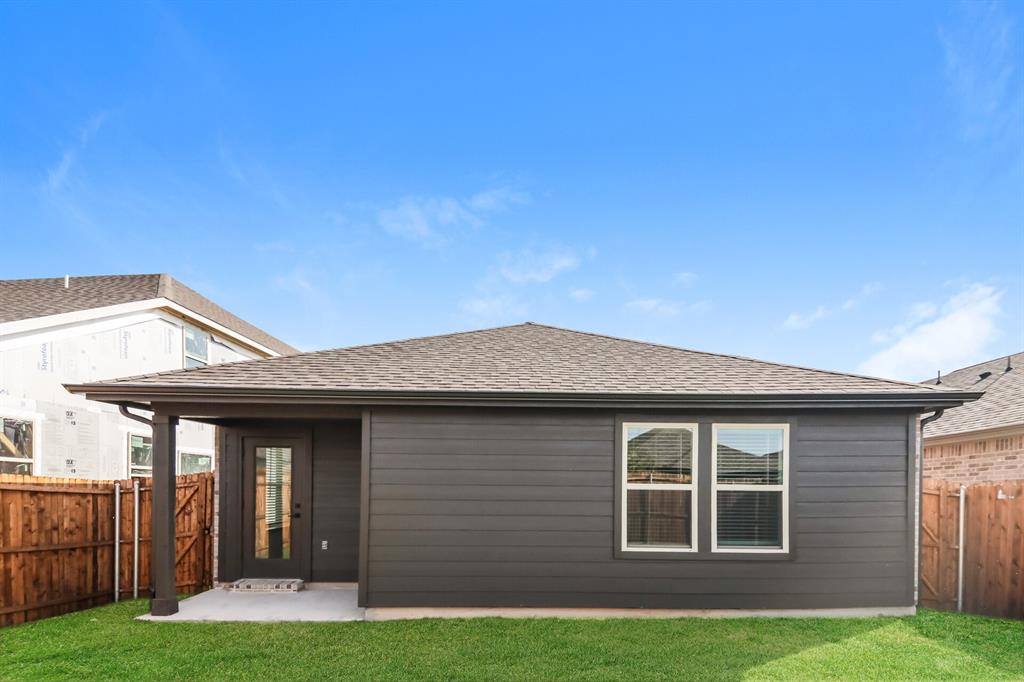 2610 Hawkins Street Anna, TX 75409 - Photo 15 of 17 Rear view of property featuring a fenced backyard, a patio area, and roof with shingles