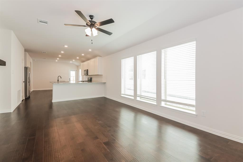 2610 Hawkins Street Anna, TX 75409 - Photo 4 of 17 Unfurnished living room featuring recessed lighting, dark wood finished floors, a ceiling fan, and lofted ceiling