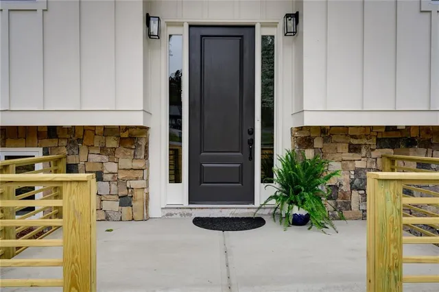 a potted plant sitting in front of a door