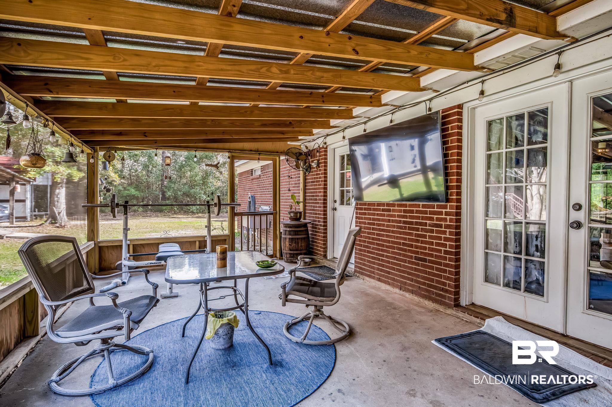 12199 Bay Road West Foley, AL 36535 - Photo 47 of 62 View of patio / terrace featuring outdoor dining area