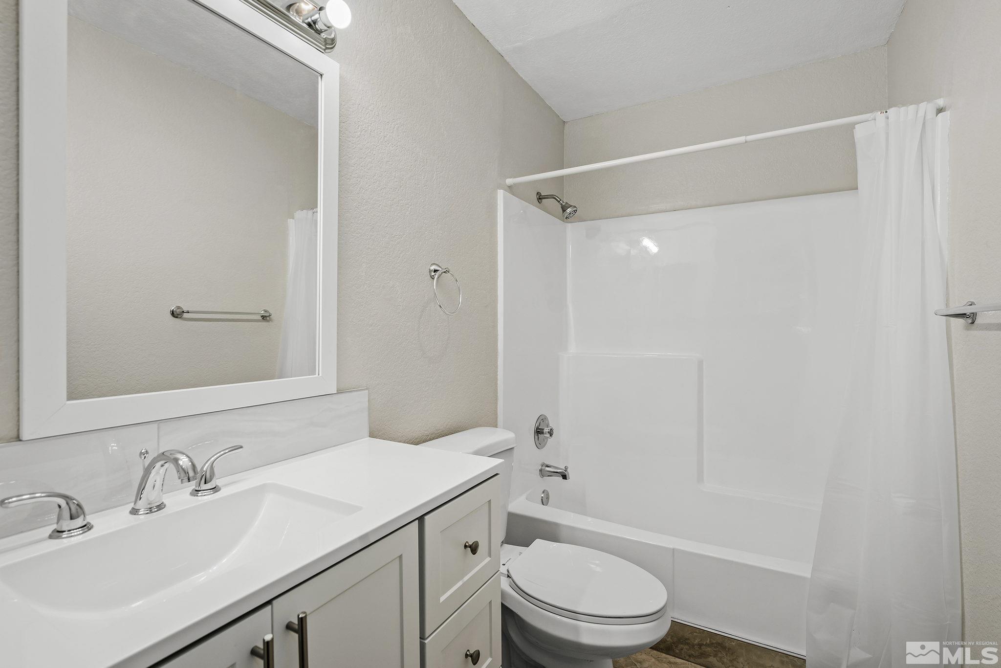 4600 Neil Road, Unit 3 Reno, NV 89502 - Photo 12 of 14 a bathroom with a sink a toilet and shower