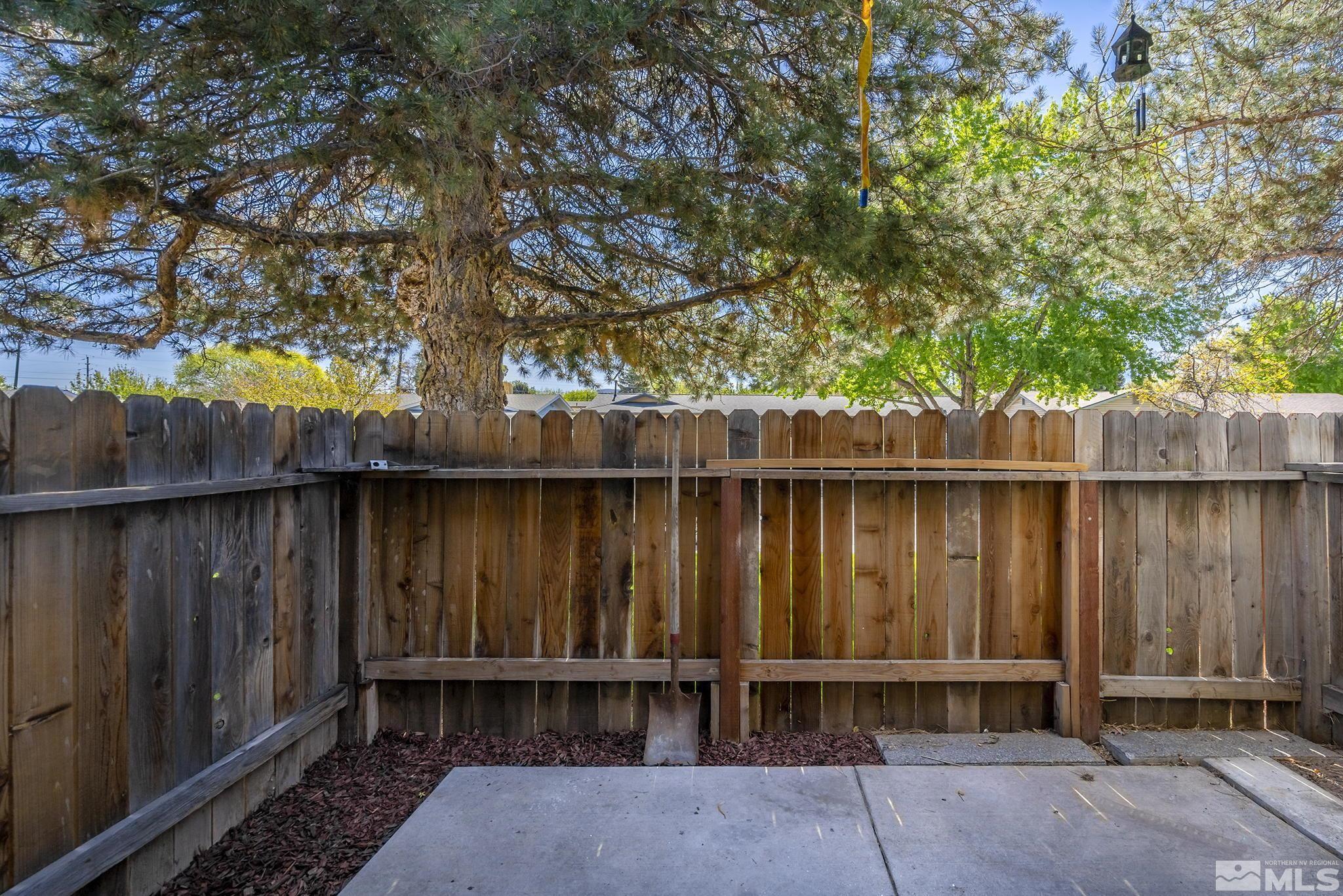 4600 Neil Road, Unit 3 Reno, NV 89502 - Photo 10 of 14 a wooden fence with a tree