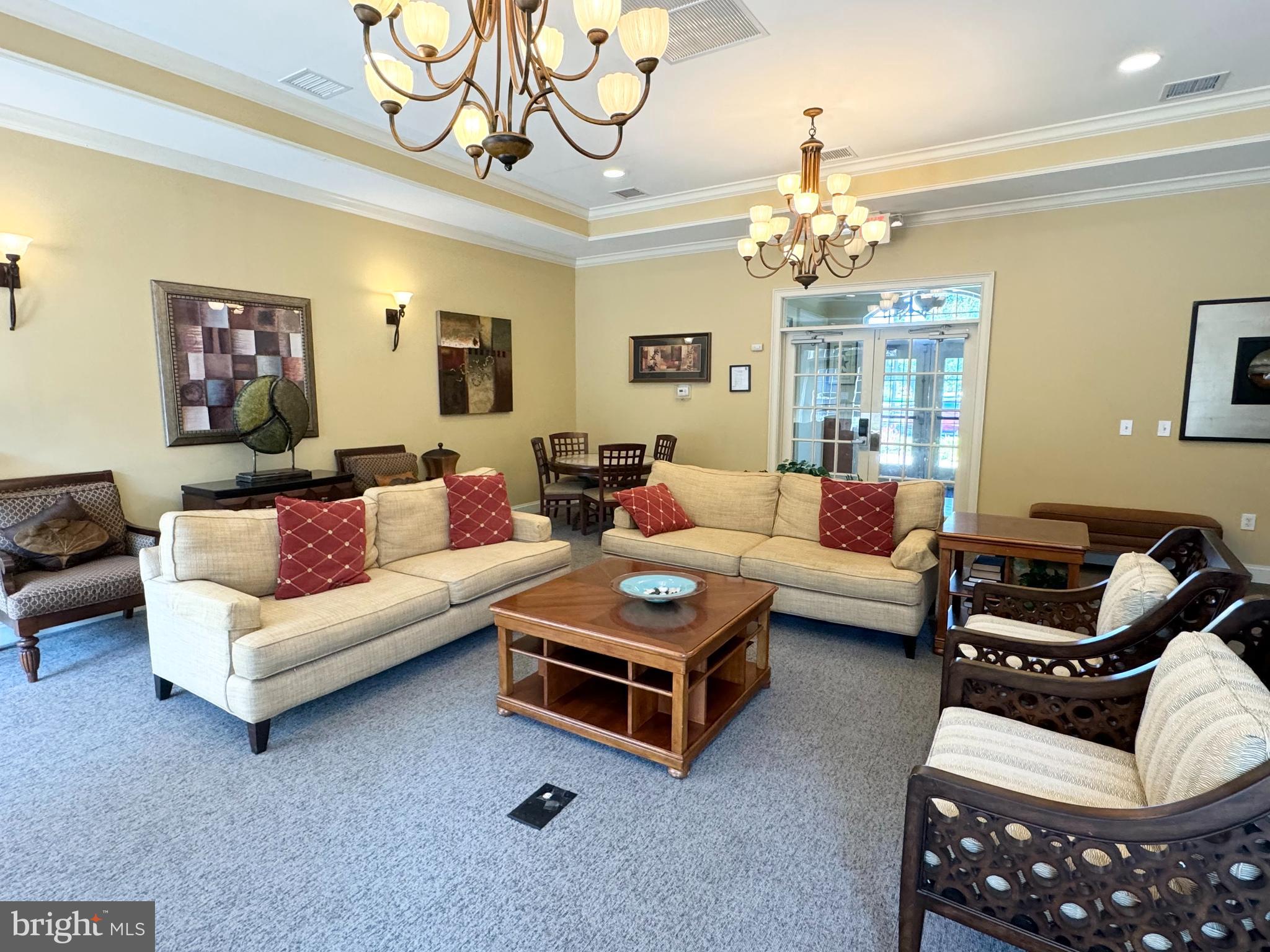 525 Timberlake Drive Ewing, NJ 08618 - Photo 15 of 27 a living room with furniture a chandelier and a couch