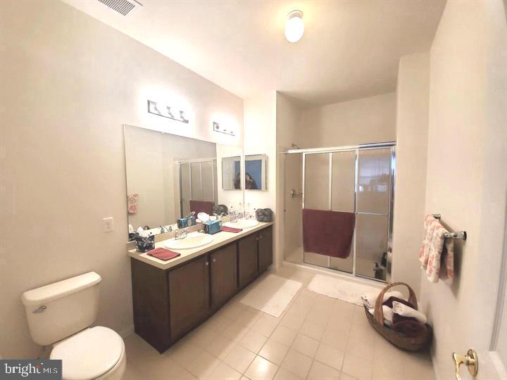 525 Timberlake Drive Ewing, NJ 08618 - Photo 7 of 27 a bathroom with a sink a toilet and mirror