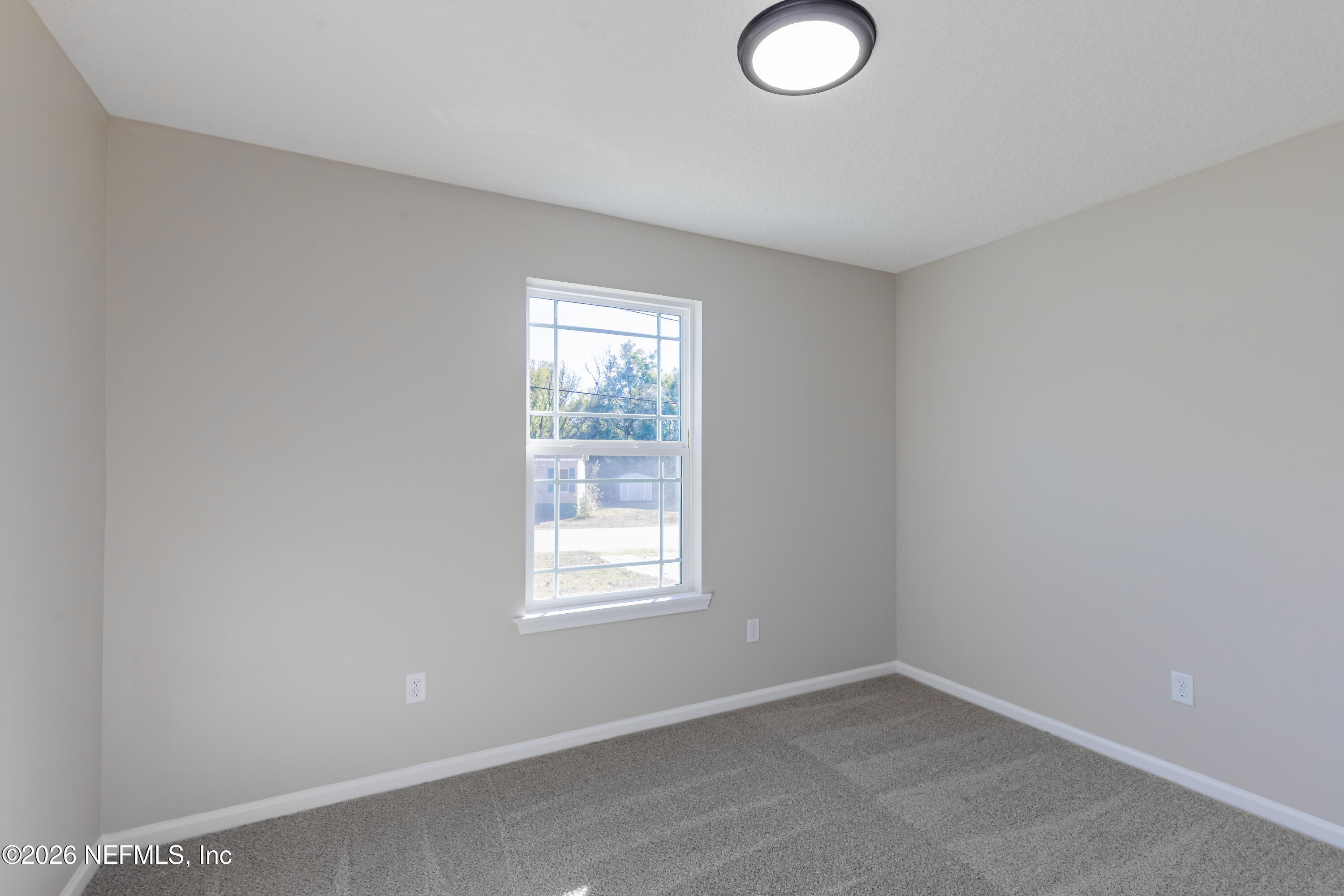6330 Alliance Avenue Keystone Heights, FL 32656 - Photo 16 of 21 an empty room with windows
