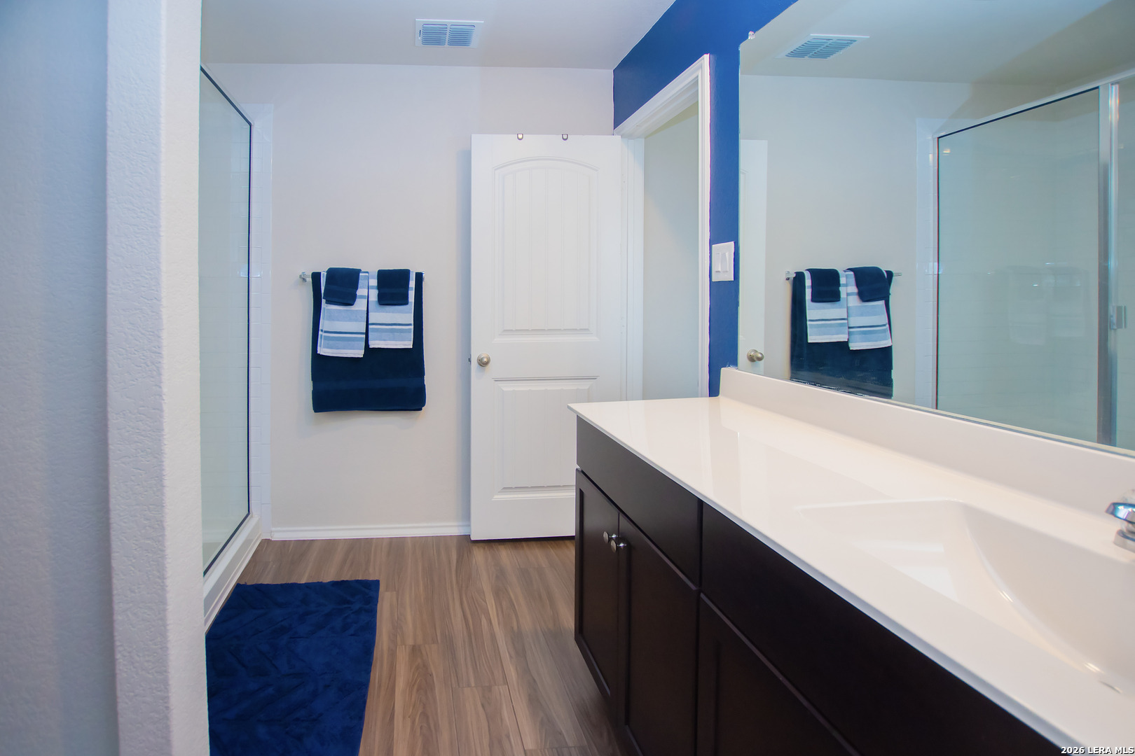 837 Indigo Way Seguin, TX 78155 - Photo 11 of 23 a room with a wooden floor and cabinets