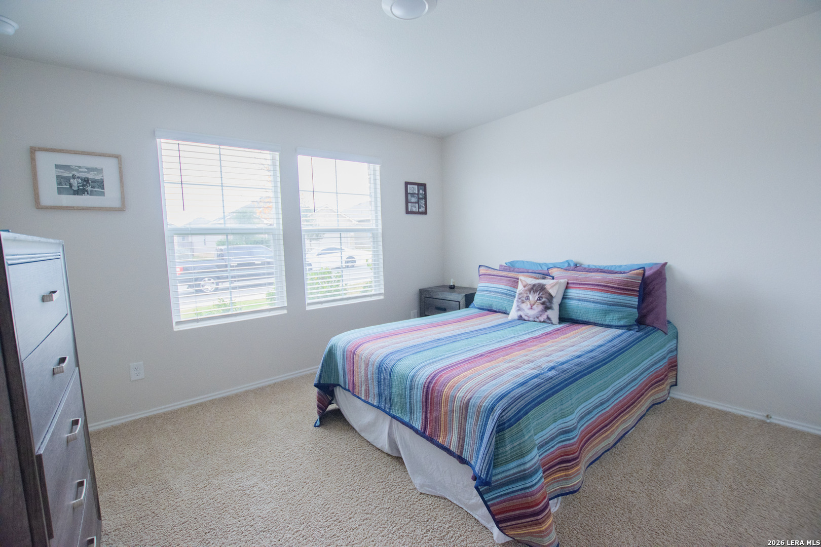 837 Indigo Way Seguin, TX 78155 - Photo 13 of 23 a bed sitting in a bedroom next to a window