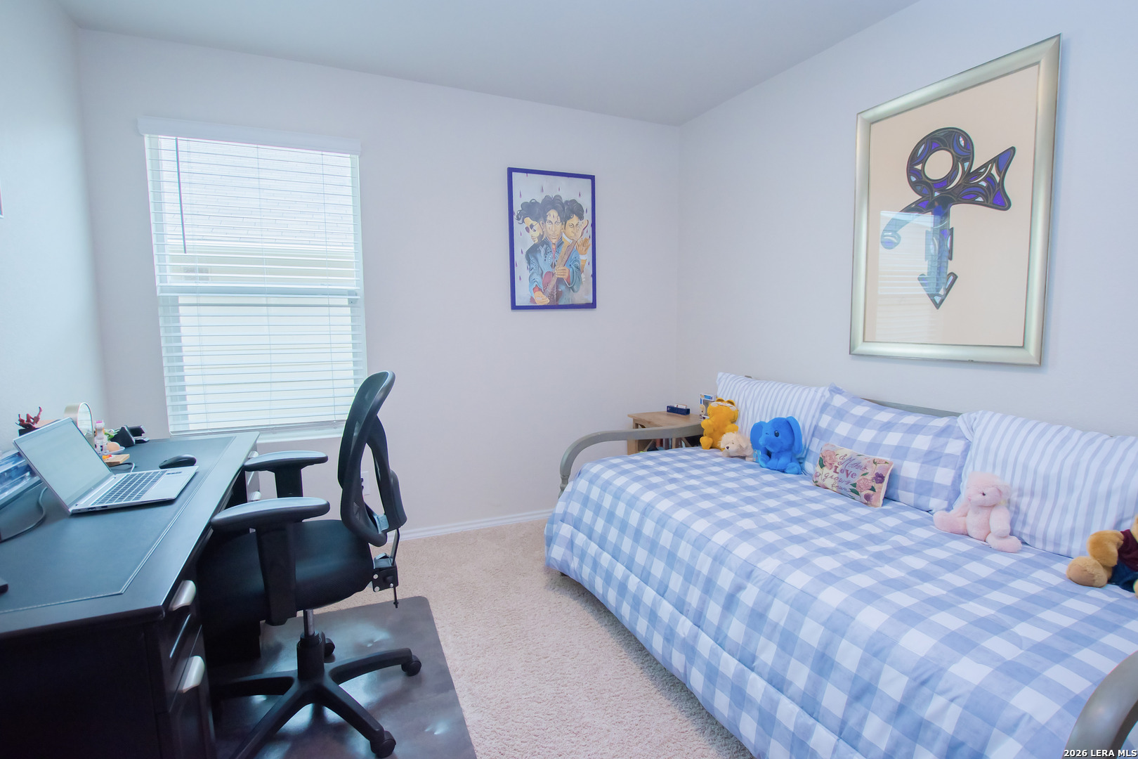 837 Indigo Way Seguin, TX 78155 - Photo 15 of 23 a bedroom with a bed and a desk