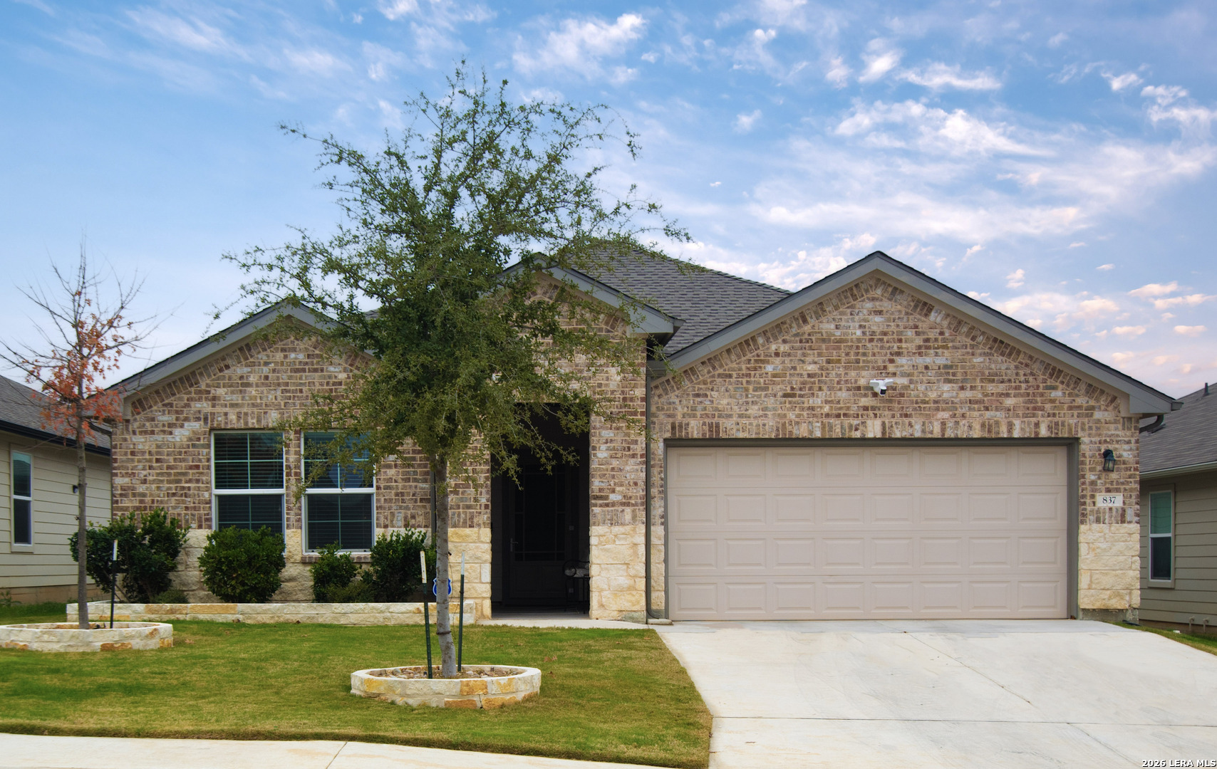 837 Indigo Way Seguin, TX 78155 - Photo 2 of 23 a front view of a house with a yard