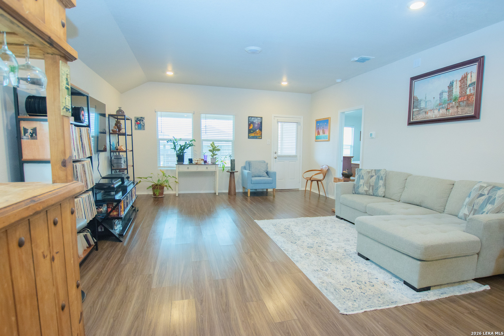 837 Indigo Way Seguin, TX 78155 - Photo 8 of 23 a living room with furniture and a wooden floor