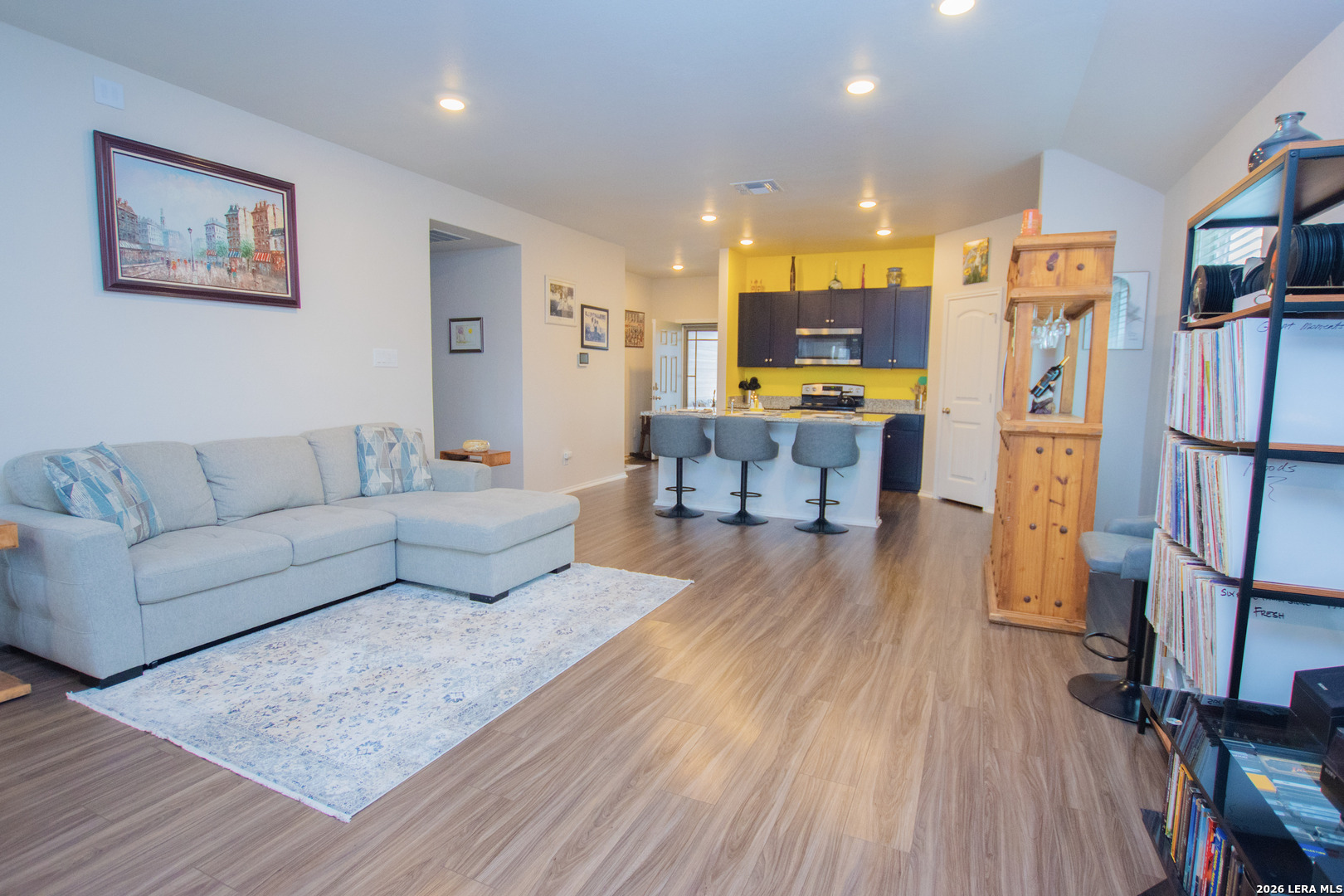 837 Indigo Way Seguin, TX 78155 - Photo 9 of 23 a living room with furniture and a wooden floor
