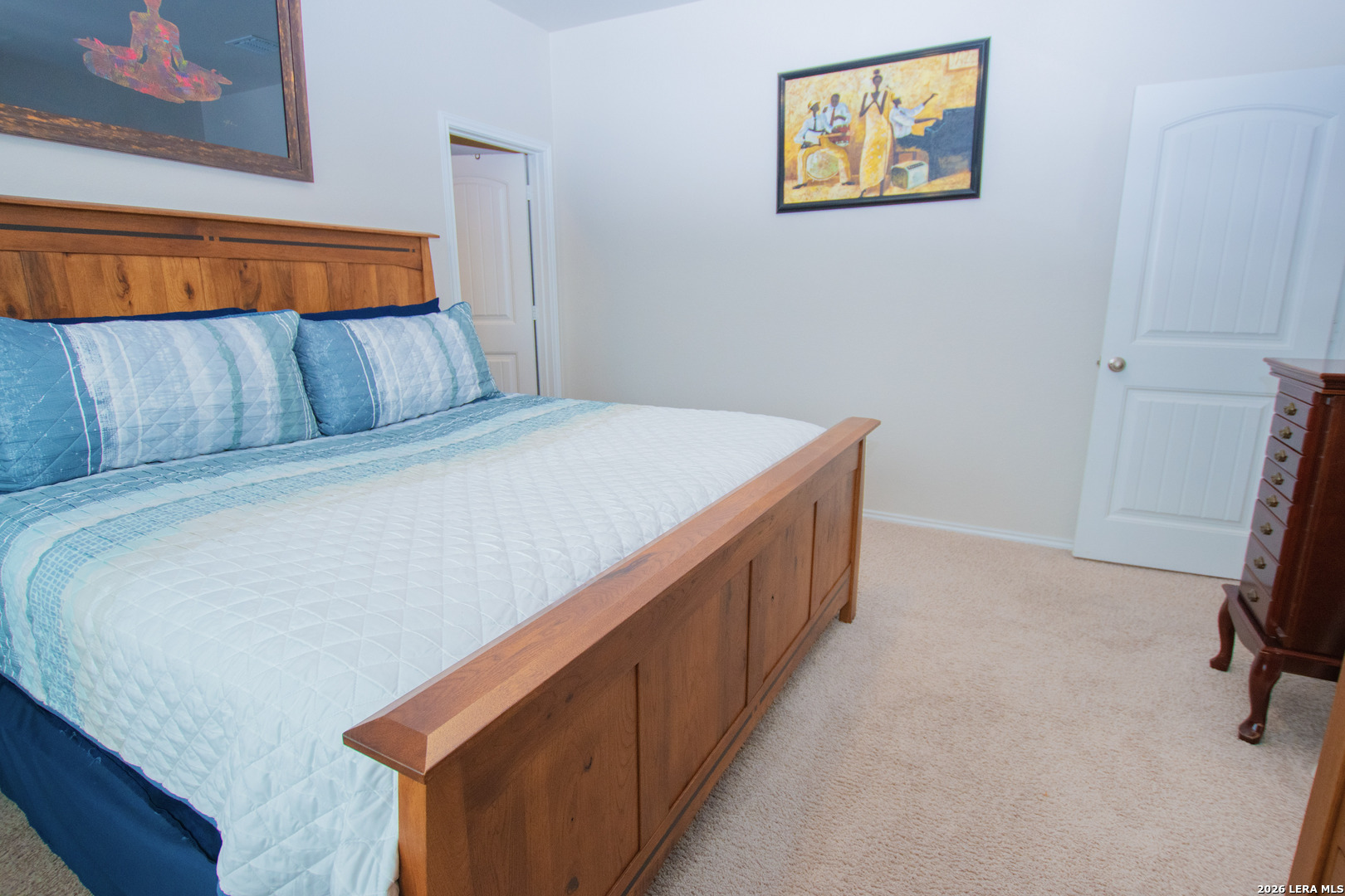 837 Indigo Way Seguin, TX 78155 - Photo 10 of 23 a bed room with a bed and a night stand